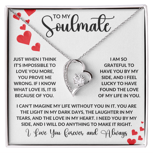 A romantic necklace with a heart-shaped pendant featuring a 6.5mm CZ crystal, surrounded by smaller crystals, in a white gold or yellow gold finish.